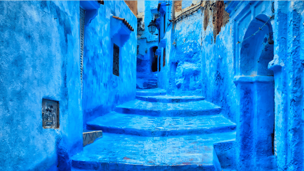 Blue alley passing beneath an archway in Chefchaouen medina